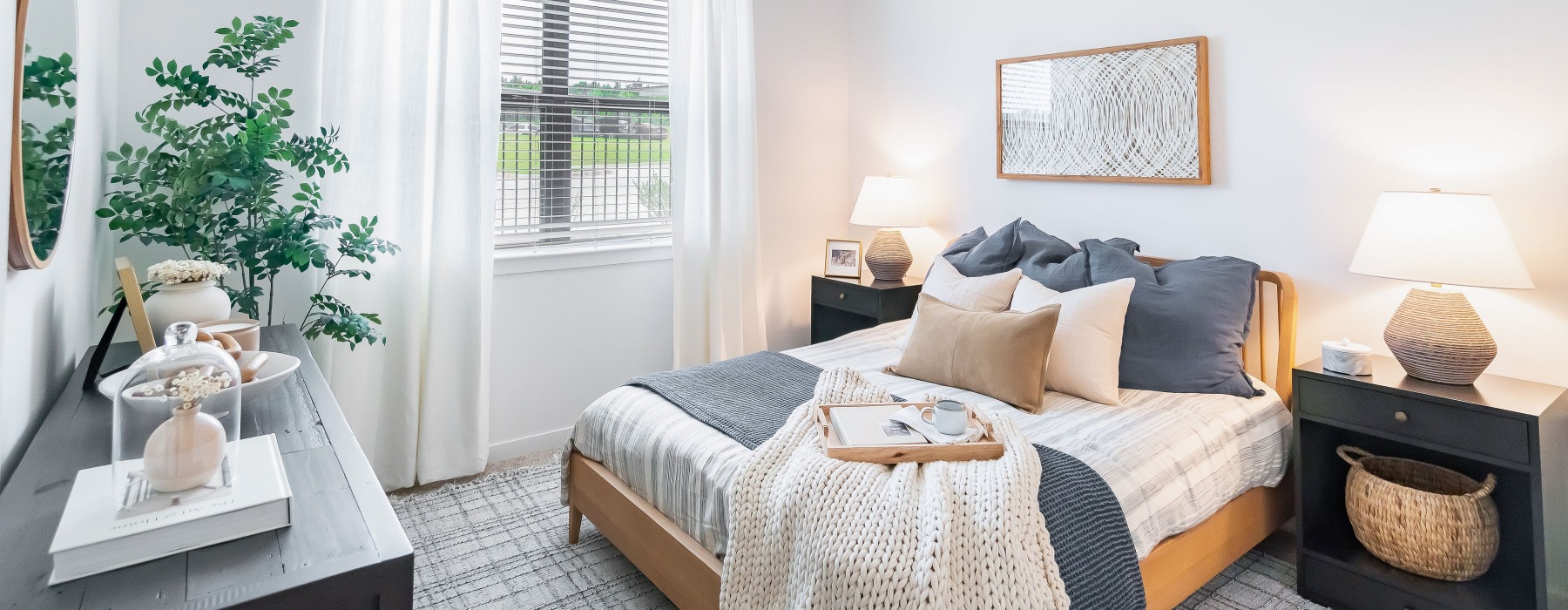 bedroom with bed dresser and lamp