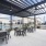 outdoor dining area with a grilling station at Citizen House Blue Bluff Apartments in East Austin, TX