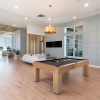 lounge with a pool table, foosball and spacious seating