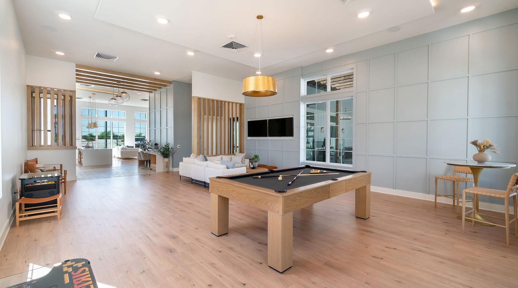 Feel at Home lounge with a pool table, foosball and spacious seating